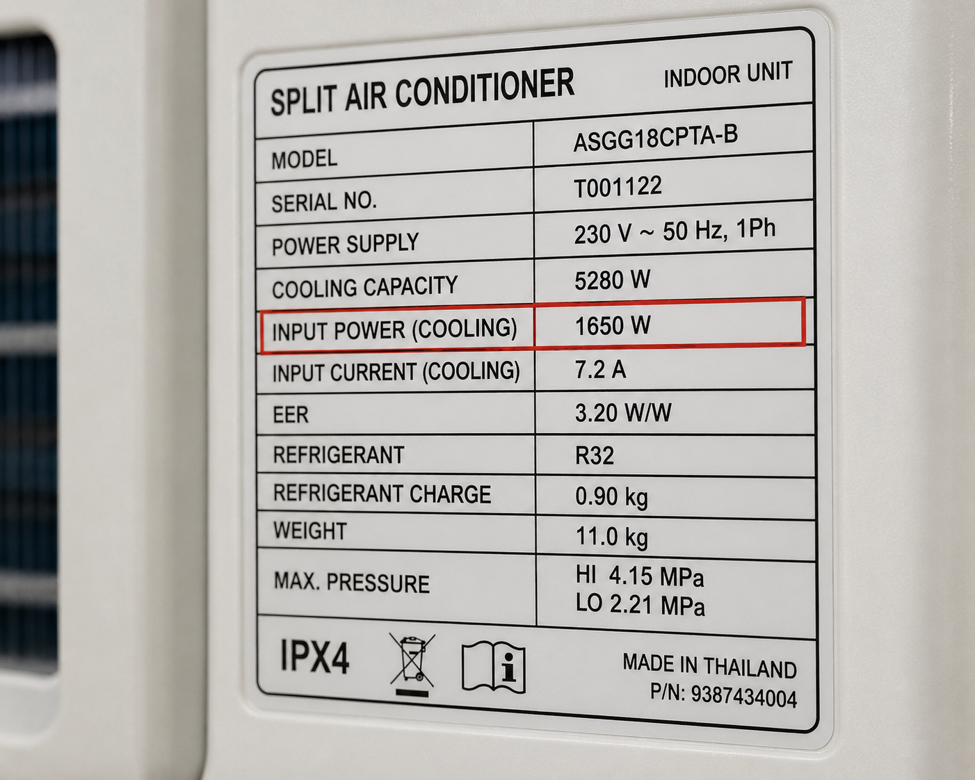 Close-up of an AC nameplate showing rated power input in watts