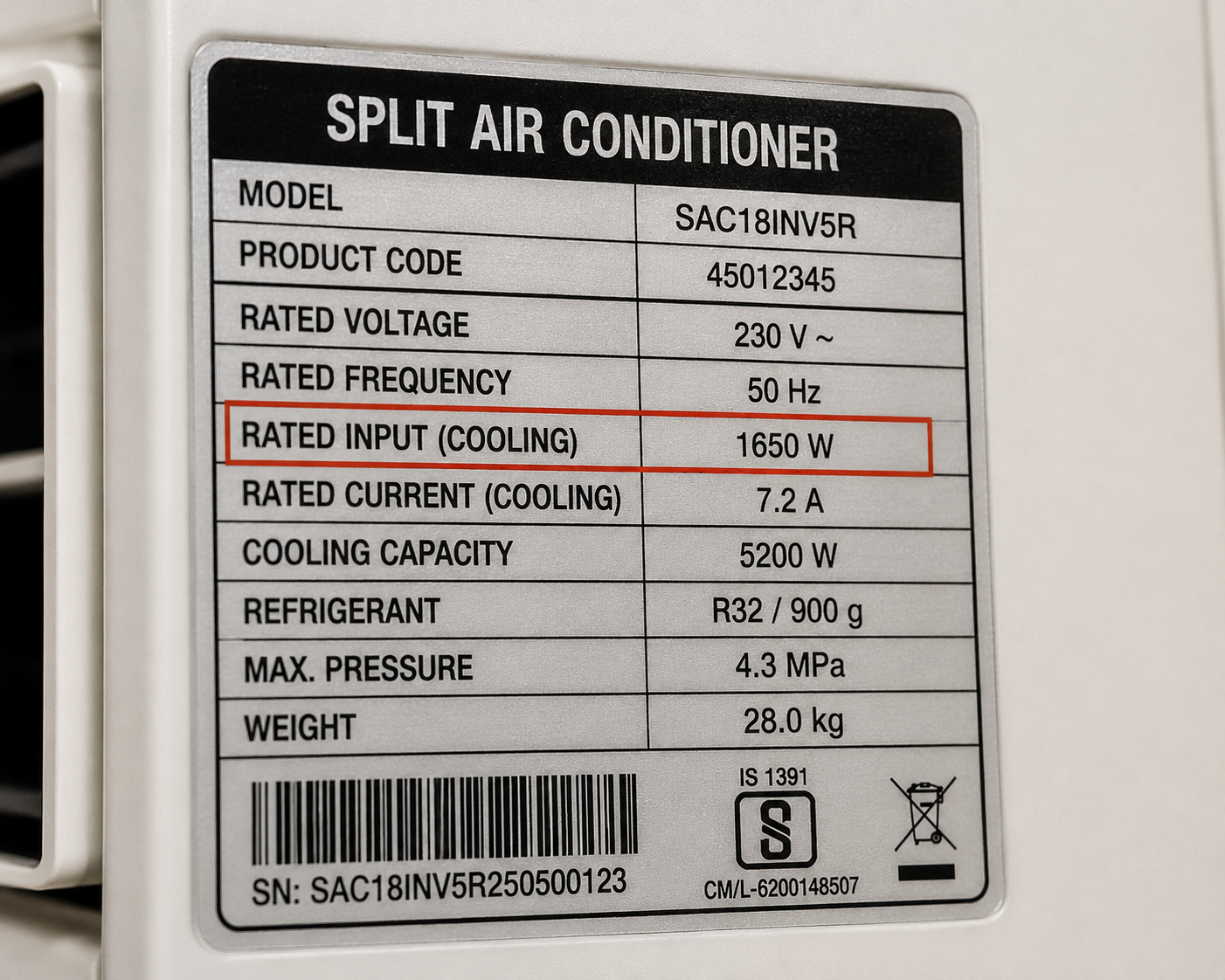 Close-up of an appliance nameplate showing rated wattage and voltage information